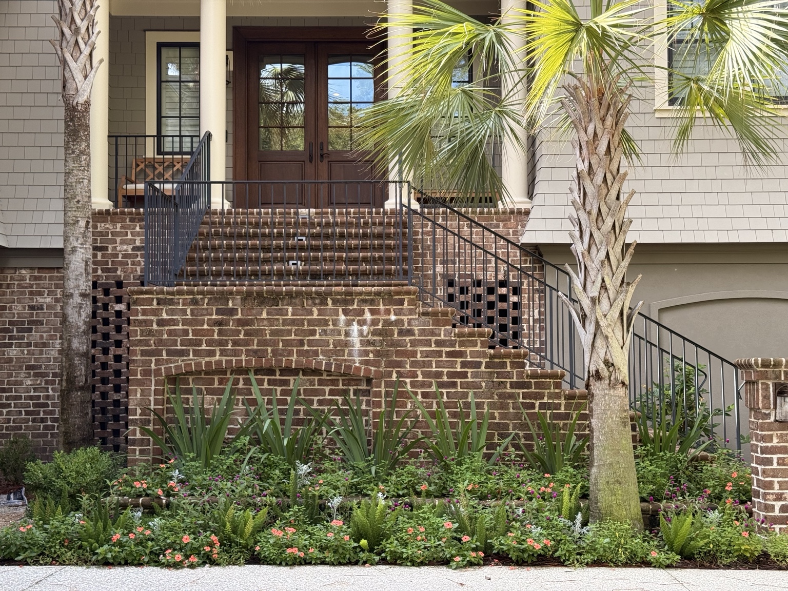 Layered seasonal color against historic brick